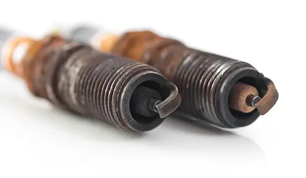 Cleansing or Replacement of Spark Plugs: